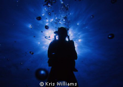 Silhouette of my sister on our morning dive. Canon S90 ma... by Kris Williams 
